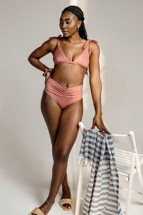 Vintage pink triangle bikini top with tieable bows on shoulders with an extra soft touch, fine lining and thick feel. Made sustainably and ethically in Europe from finest polyamide. Perfected fit for every body shape.